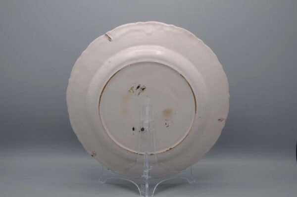 French faience dish with polychrome decoration of a trendy bird, Nevers or La Rochelle, ca 1800
