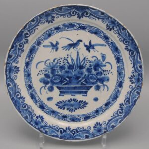 Pieter Kocx, 'De Greek A' - early 18th Century Dutch Delft plate depicting floral basket and birds