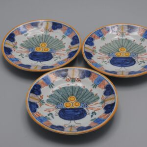 Set of hand-painted miniature polychrome plates with Delft peacock decor, ca 1900