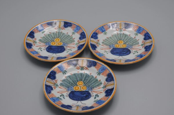 Set of hand-painted miniature polychrome plates with Delft peacock decor, ca 1900