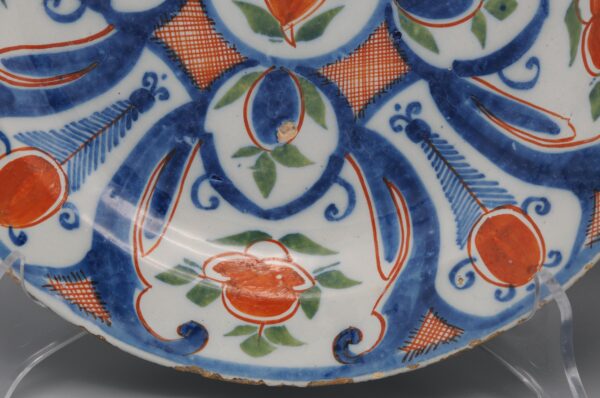 Pair of 18th century polychrome Delft blue, green and orange plates by 'De Paauw'