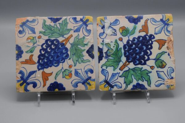 Polychrome Delft Tiles (pair) with grapes, early 17th centuryPolychrome Delft Tiles (pair) with grapes, early 17th century