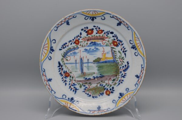 Delft polychrome plate with a cartouche depicting ships - mid 18th century