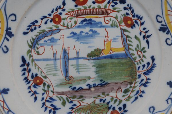 Delft polychrome plate with a cartouche depicting ships - mid 18th century