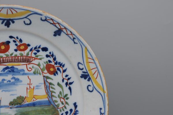 Delft polychrome plate with a cartouche depicting ships - mid 18th century