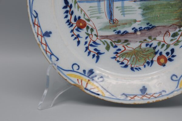 Delft polychrome plate with a cartouche depicting ships - mid 18th century
