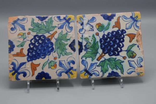 Polychrome Delft Tiles (pair) with grapes, early 17th centuryPolychrome Delft Tiles (pair) with grapes, early 17th century