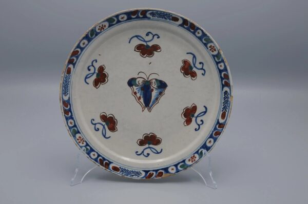 Delft polychrome plate with a butterfly - early 18th century