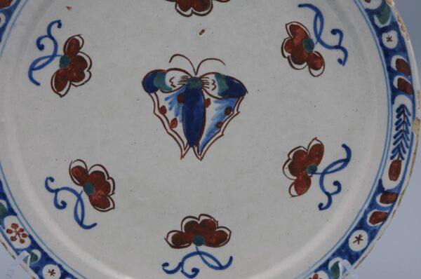 Delft polychrome plate with a butterfly - early 18th century
