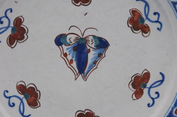 Delft polychrome plate with a butterfly - early 18th century