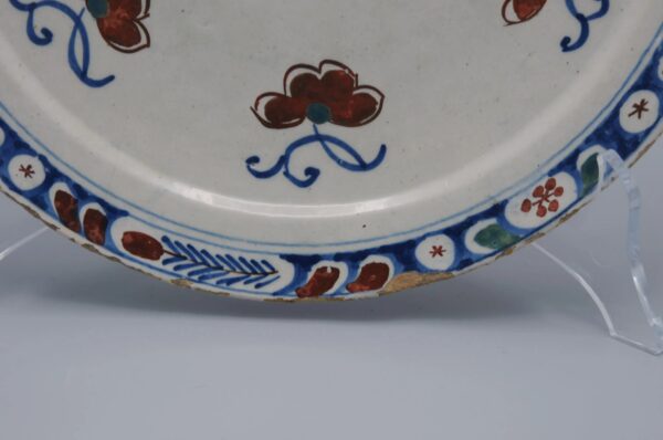 Delft polychrome plate with a butterfly - early 18th century